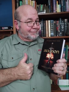 Nick Lupton holding his book Avignon